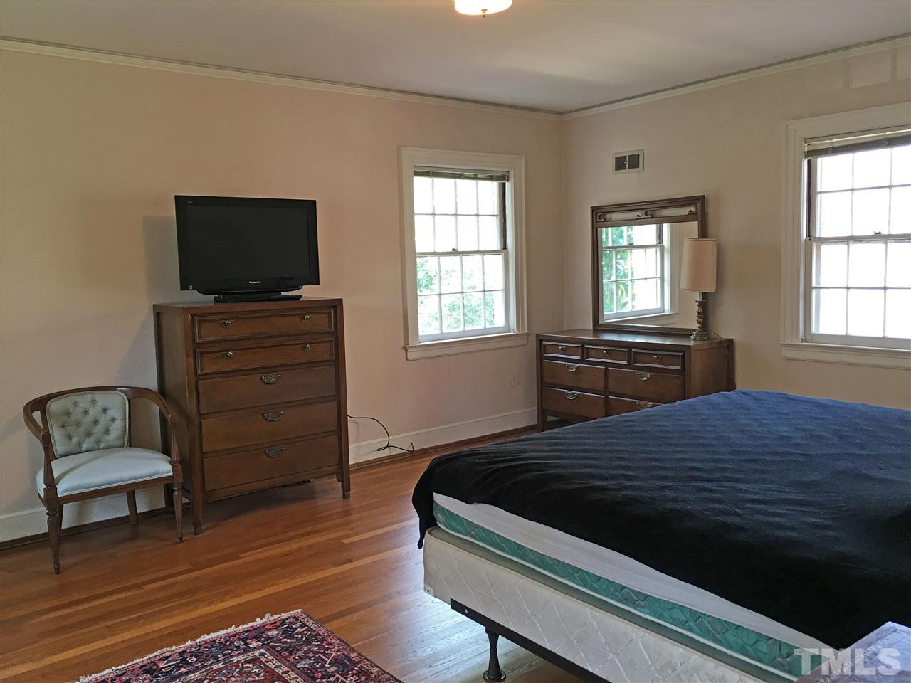 7 Sylvan Road Durham, NC 27701 - Photo 16 of 25 a bedroom with a bed and a television