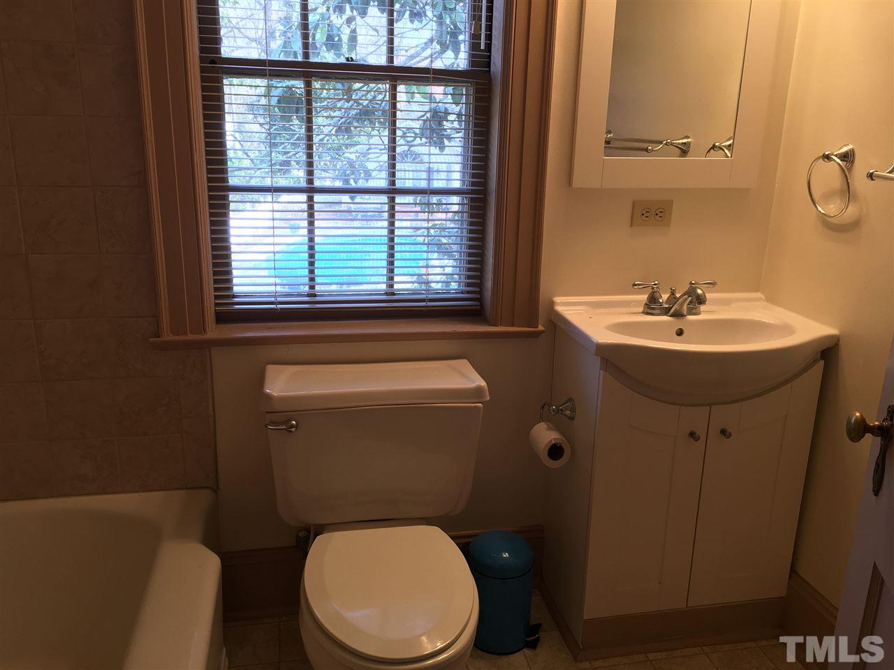 7 Sylvan Road Durham, NC 27701 - Photo 17 of 25 a bathroom with a sink a toilet and a mirror