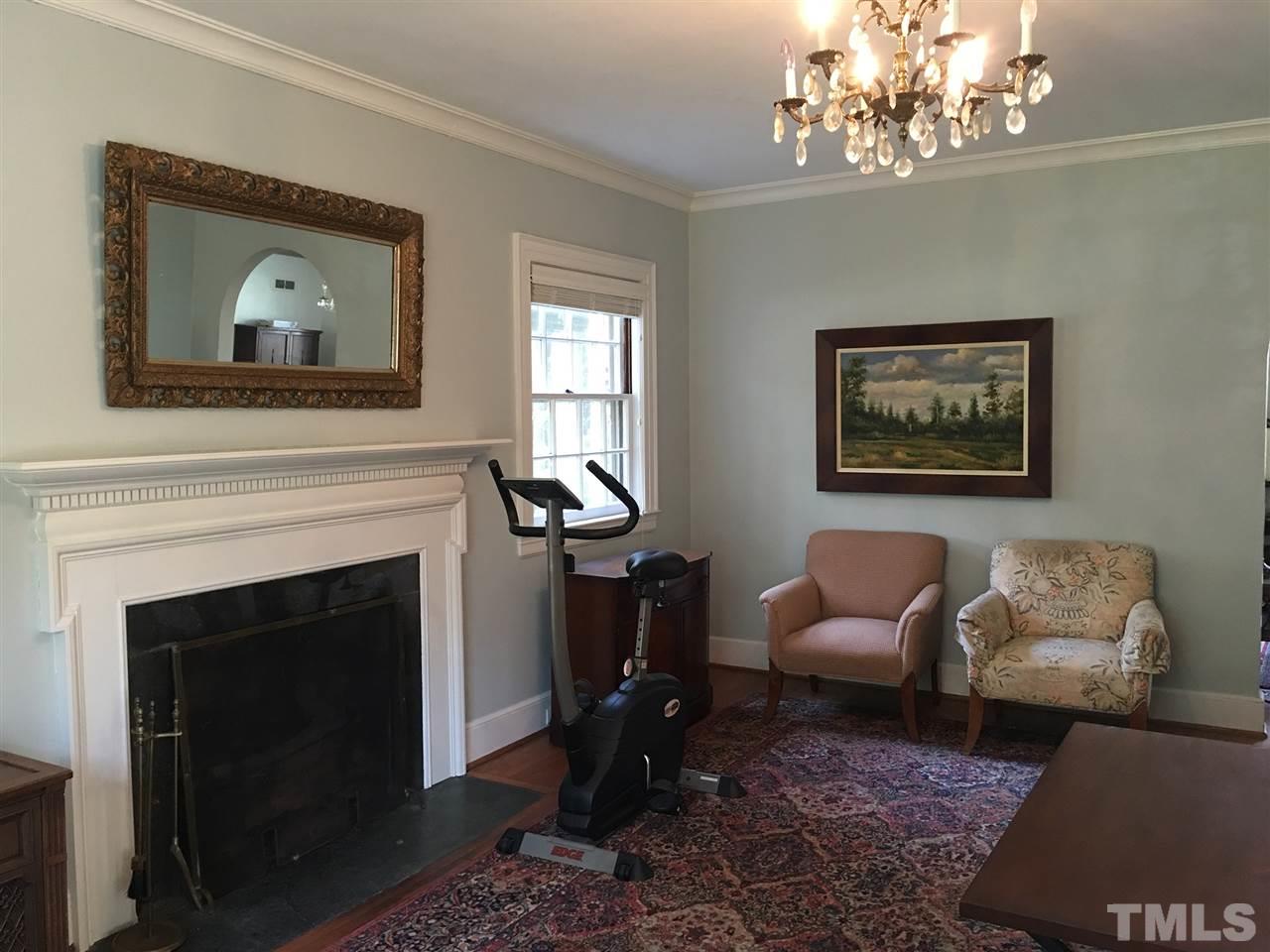7 Sylvan Road Durham, NC 27701 - Photo 4 of 25 a living room with furniture a chandelier and a fireplace
