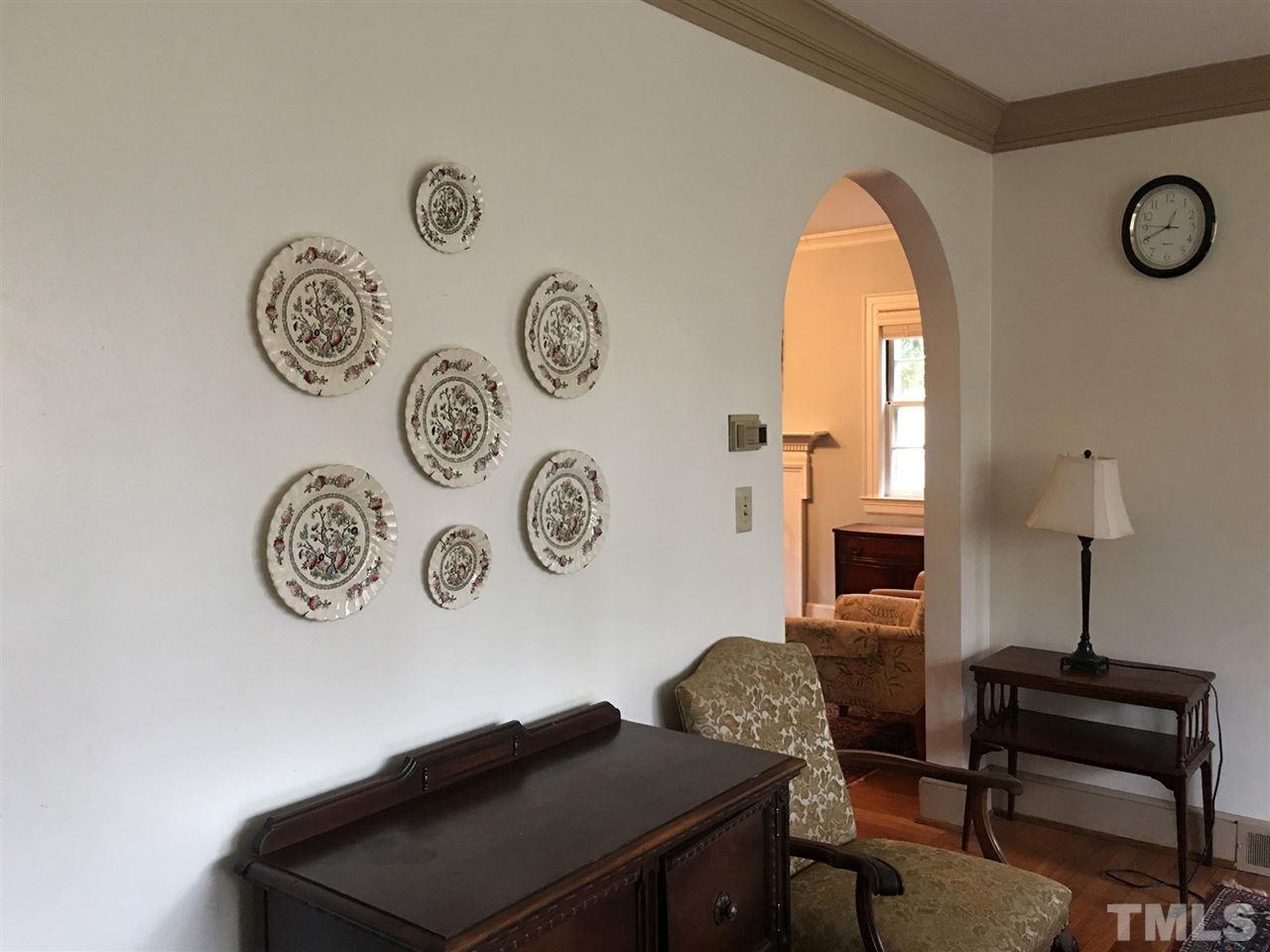 7 Sylvan Road Durham, NC 27701 - Photo 5 of 25 a view of a workspace with a table and a chair