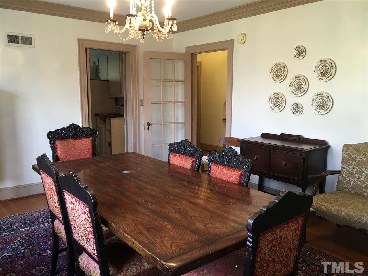7 Sylvan Road Durham, NC 27701 - Photo 6 of 25 a view of a dining room with furniture and a chandelier