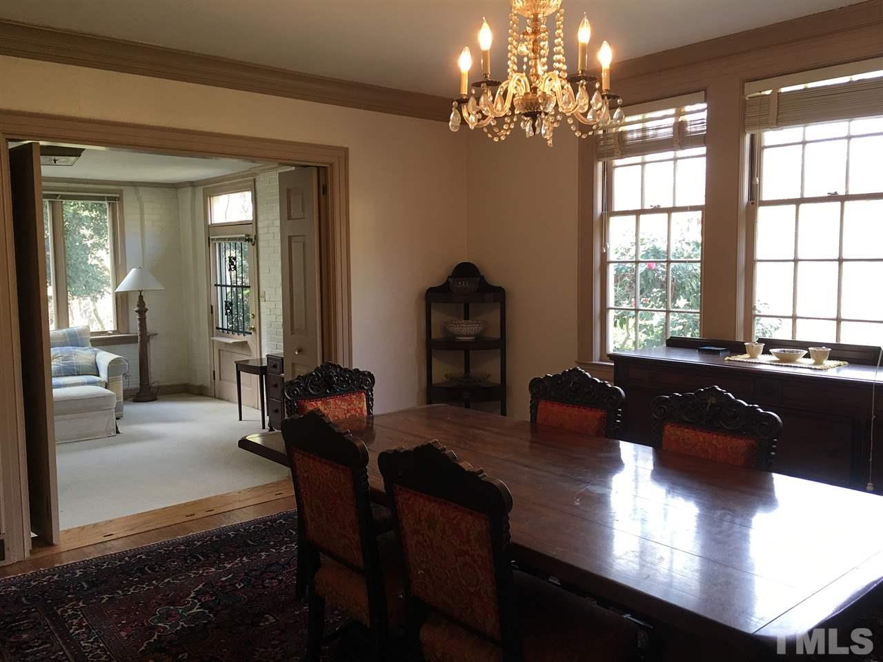 7 Sylvan Road Durham, NC 27701 - Photo 7 of 25 a living room with furniture and a chandelier