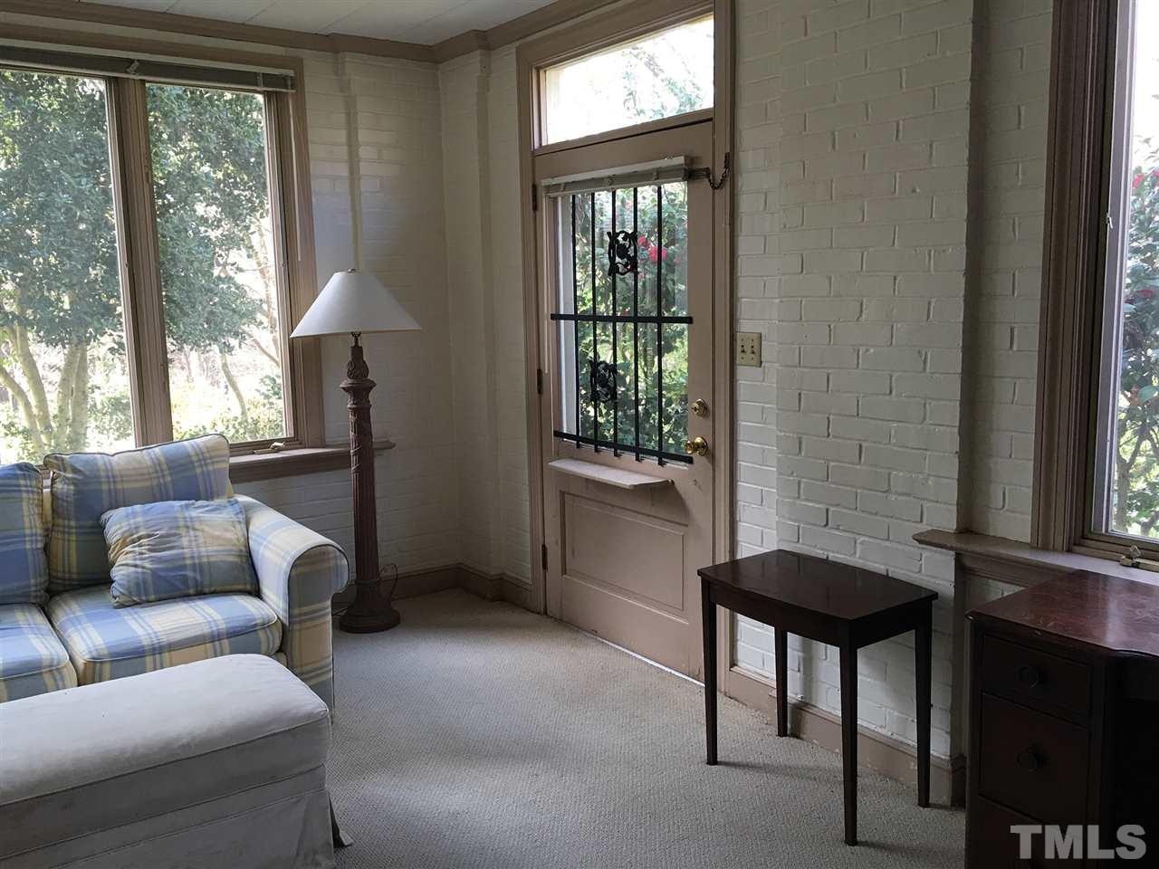 7 Sylvan Road Durham, NC 27701 - Photo 8 of 25 a living room with furniture and a window