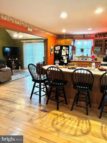 a view of a dining table and chairs in the patio