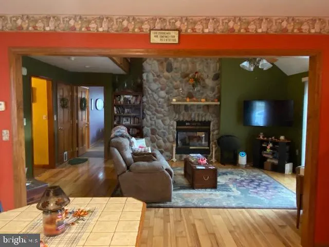 a living room with furniture a window and kitchen view