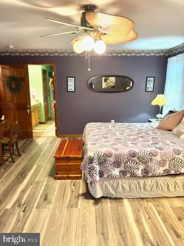 a bathroom with a tub and a window