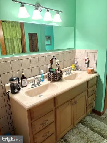 a bathroom with a bathtub and shower