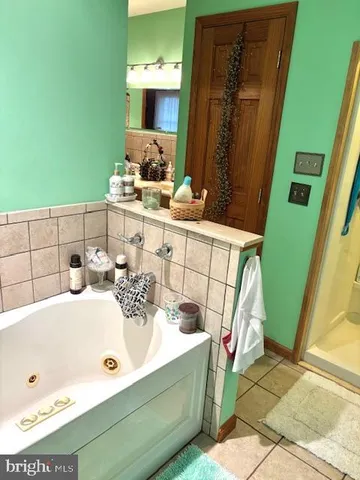 a view of swimming pool with seating area