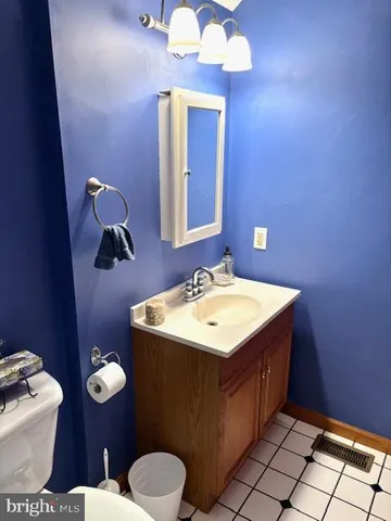 a view of a storage & utility room with a sink