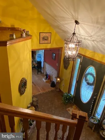 a room with stainless steel appliances granite countertop a stove and a sink