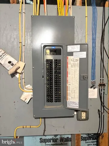 a view of a house with a wooden fence