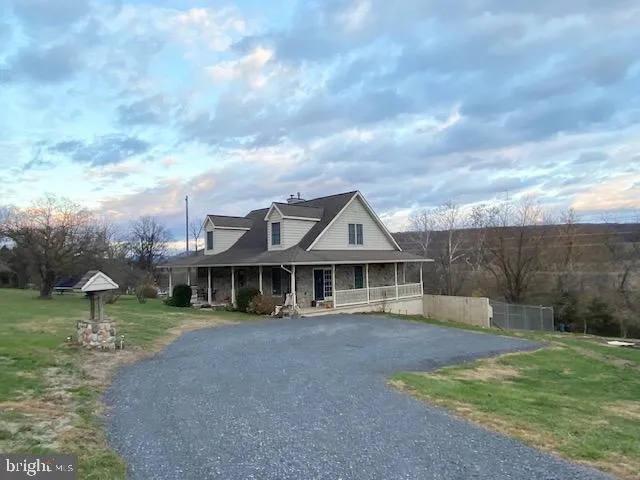 a view of a yard with an outdoor seating