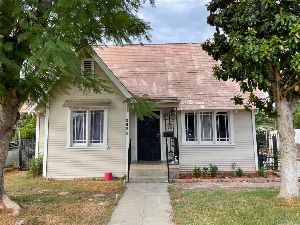 4159 Larchwood Place Riverside, CA 92506 - Photo 1 of 1 a front view of a house with a yard