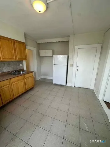 a view of a kitchen with a sink cabinets and a window