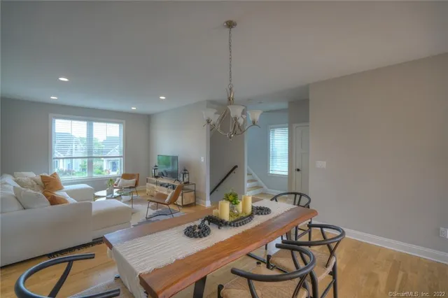 a living room with furniture a window and gym equipment