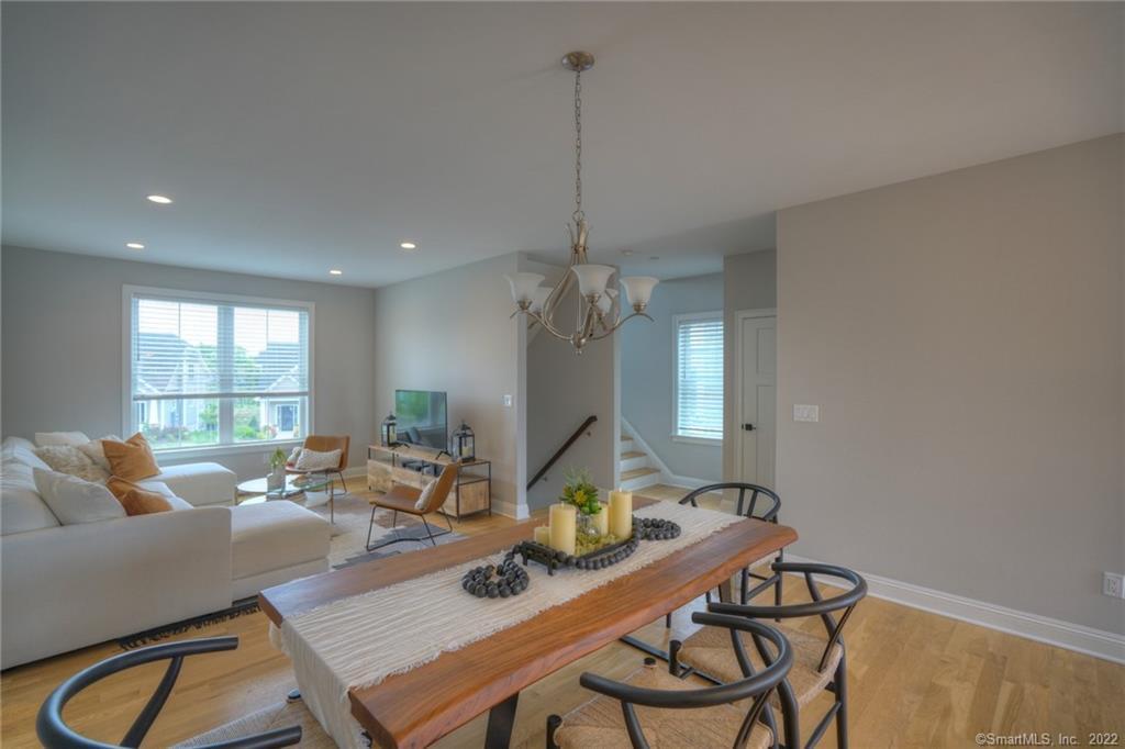 46 Park Avenue, Unit 46 Mystic, CT 06355 - Photo 12 of 28 a living room with furniture a window and gym equipment