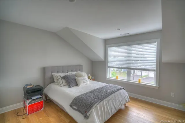 a bedroom with bed and window