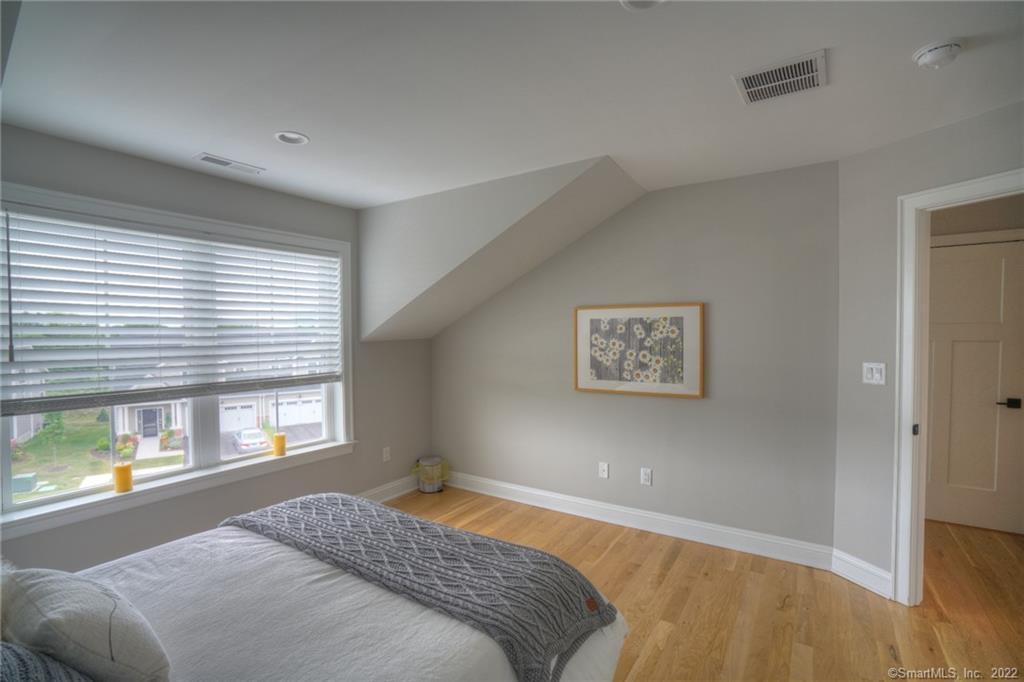 46 Park Avenue, Unit 46 Mystic, CT 06355 - Photo 21 of 28 a bedroom with a bed and a window