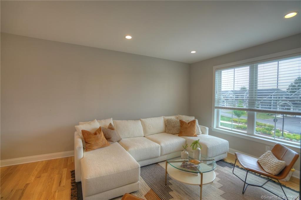 46 Park Avenue, Unit 46 Mystic, CT 06355 - Photo 7 of 28 a living room with furniture and a large window