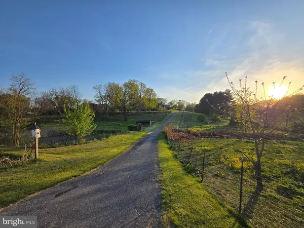 a view of a lake with a yard