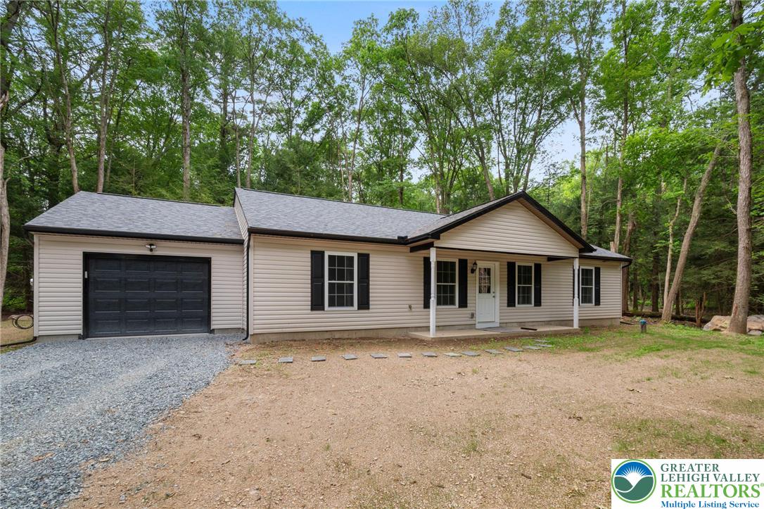 a front view of a house with yard