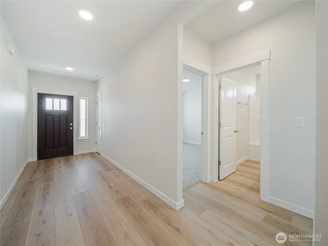 a view of entryway with wooden floor
