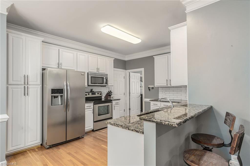 7611 Kristen Drive Oak Ridge, NC 27310 - Photo 4 of 25 Updated kitchen