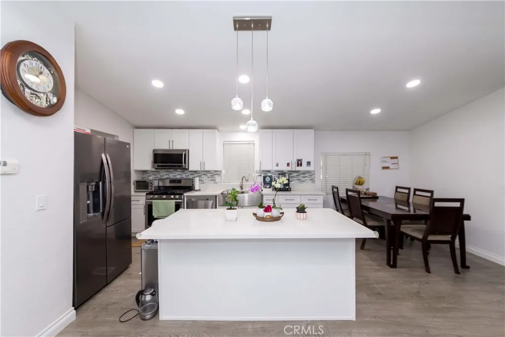 1051 Site, Unit 231 Brea, CA 92821 - Photo 13 of 34 a view of a dining area with furniture and kitchen view