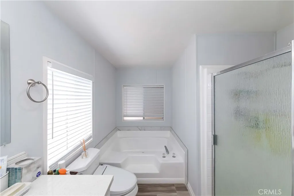 1051 Site, Unit 231 Brea, CA 92821 - Photo 23 of 34 a bathroom with a sink toilet and shower