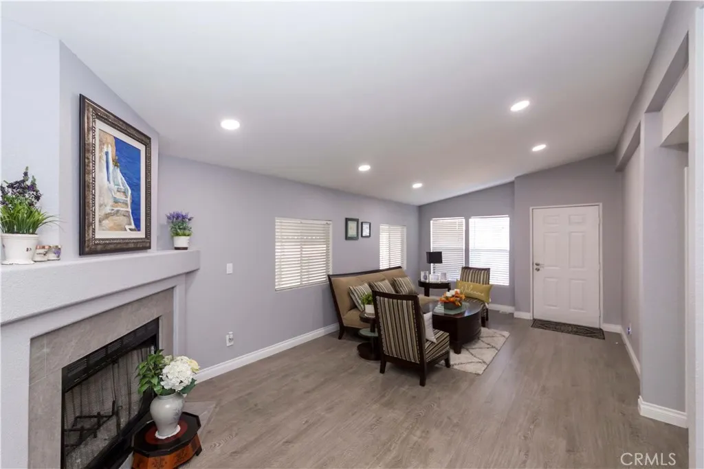 1051 Site, Unit 231 Brea, CA 92821 - Photo 24 of 34 a living room with furniture and a fireplace