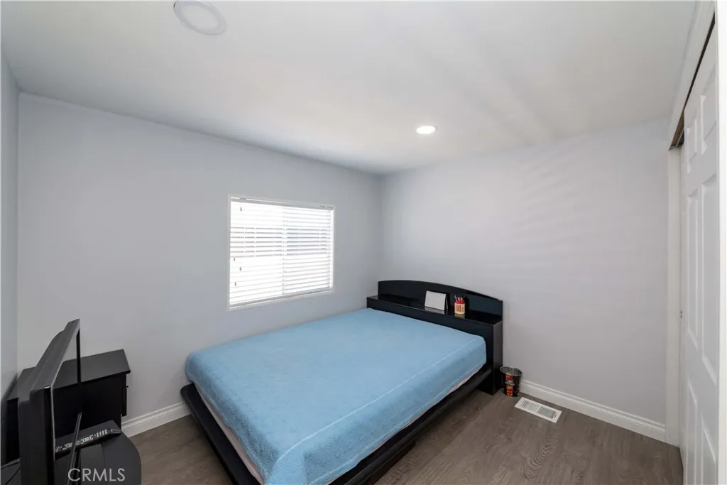 1051 Site, Unit 231 Brea, CA 92821 - Photo 30 of 34 a bedroom with a bed and a window