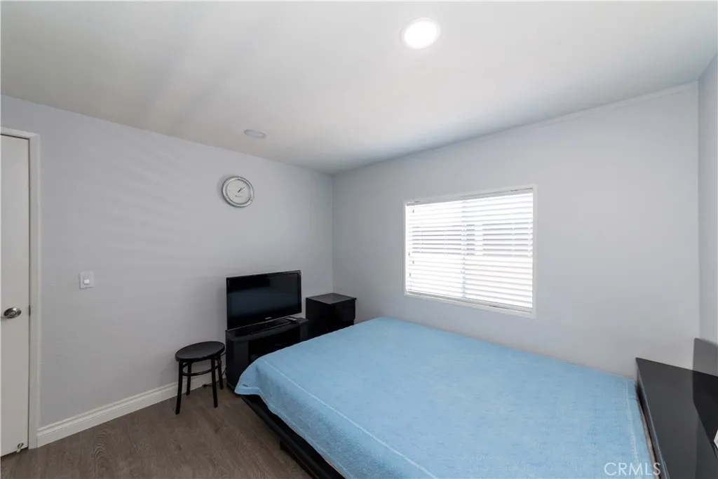 1051 Site, Unit 231 Brea, CA 92821 - Photo 32 of 34 a bedroom with a bed and a window