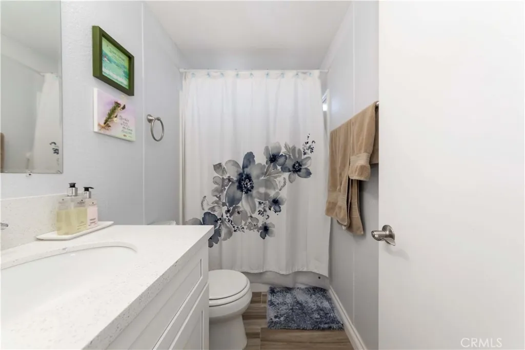 1051 Site, Unit 231 Brea, CA 92821 - Photo 33 of 34 a bathroom with a sink toilet and shower