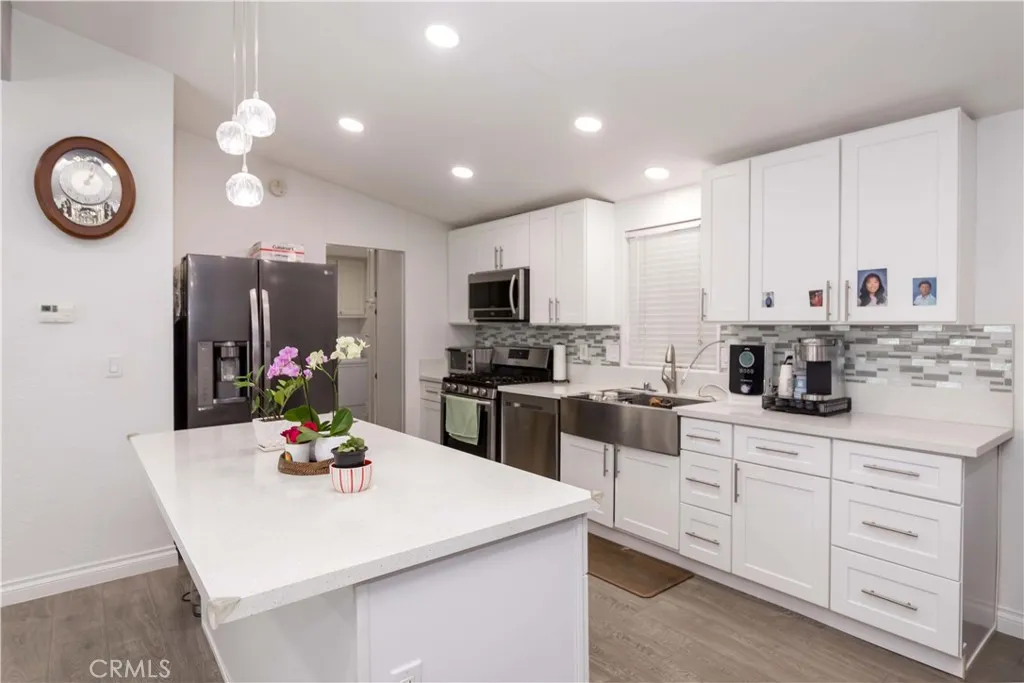 1051 Site, Unit 231 Brea, CA 92821 - Photo 9 of 34 a kitchen with cabinets a sink and appliances