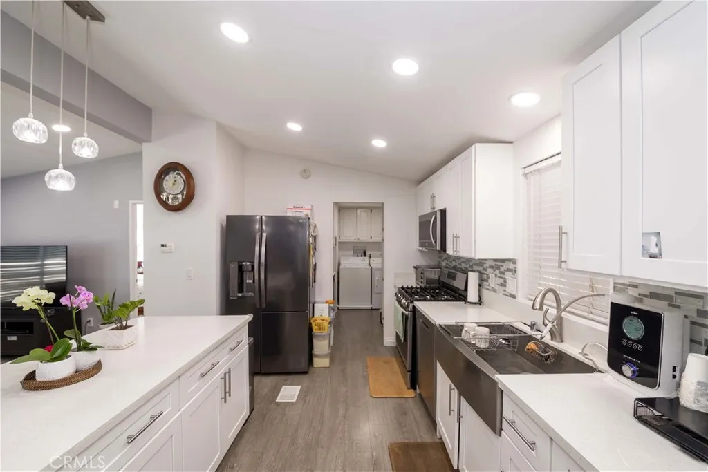 1051 Site, Unit 231 Brea, CA 92821 - Photo 10 of 34 a kitchen with granite countertop a sink stove and refrigerator