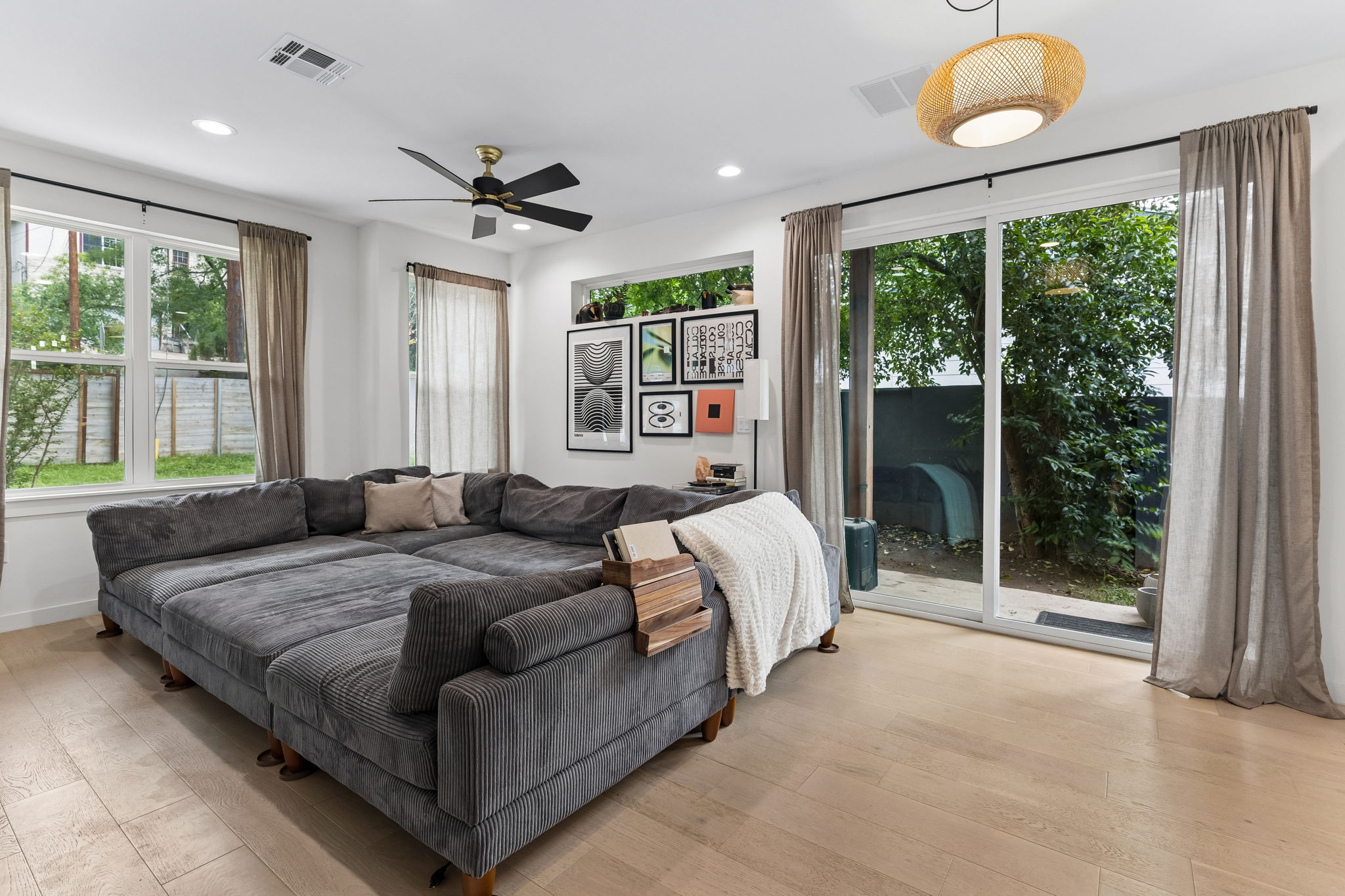 5305 Ledesma Road, Unit 1 Austin, TX 78721 - Photo 21 of 26 A secondary bedroom that maintains the home's bright aesthetic. This versatile space is perfect for a guest room, nursery, or a dedicated home office, complete with a generous closet and large windows.
