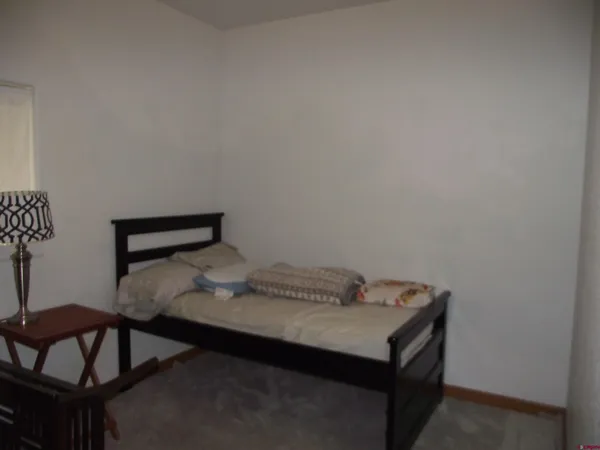 a room with furniture and a potted plant