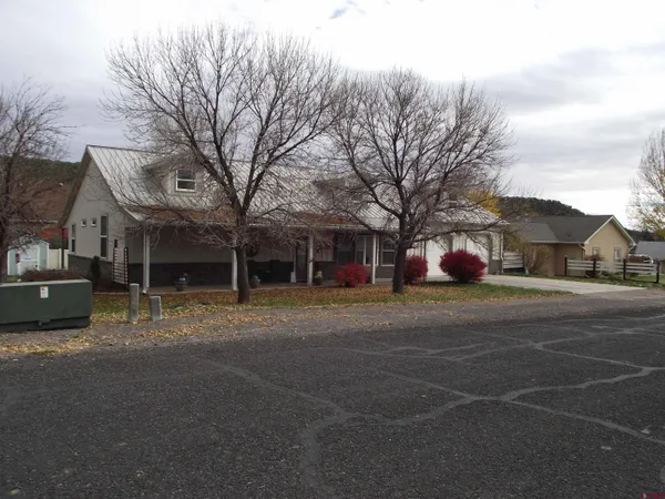 a kitchen with granite countertop a sink stove and cabinets