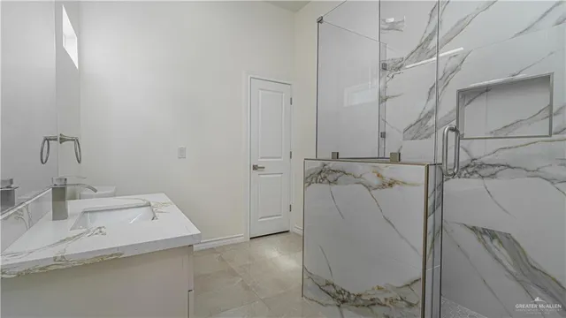 a bathroom with a sink and mirror