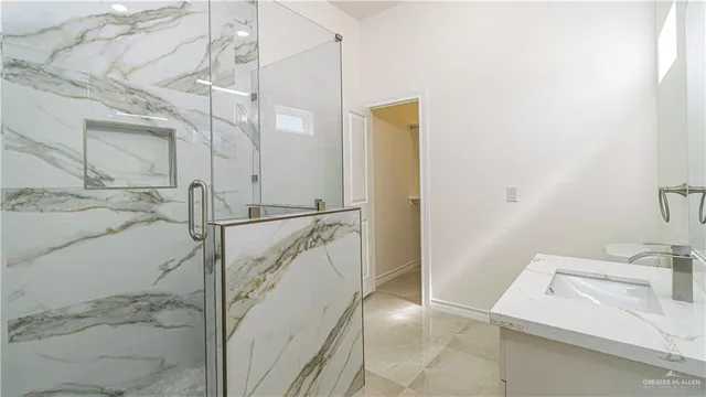 a bathroom with a sink and a shower