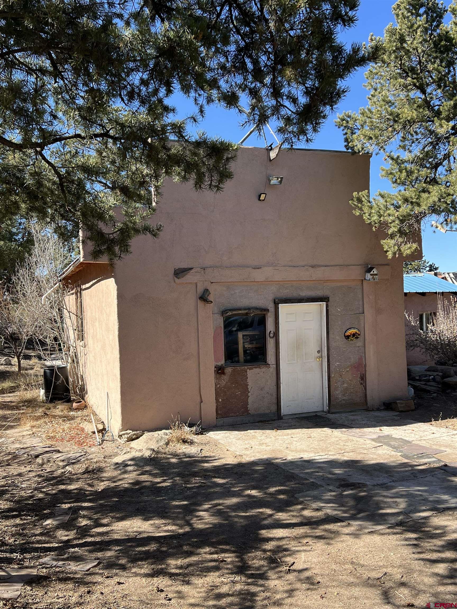 7371 County Road 310 Ignacio, CO 81137 - Photo 21 of 21 a front view of a house with a yard