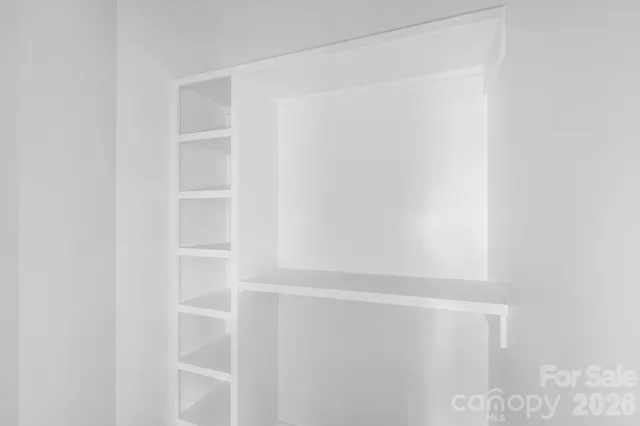 a view of small space with racks on the wall