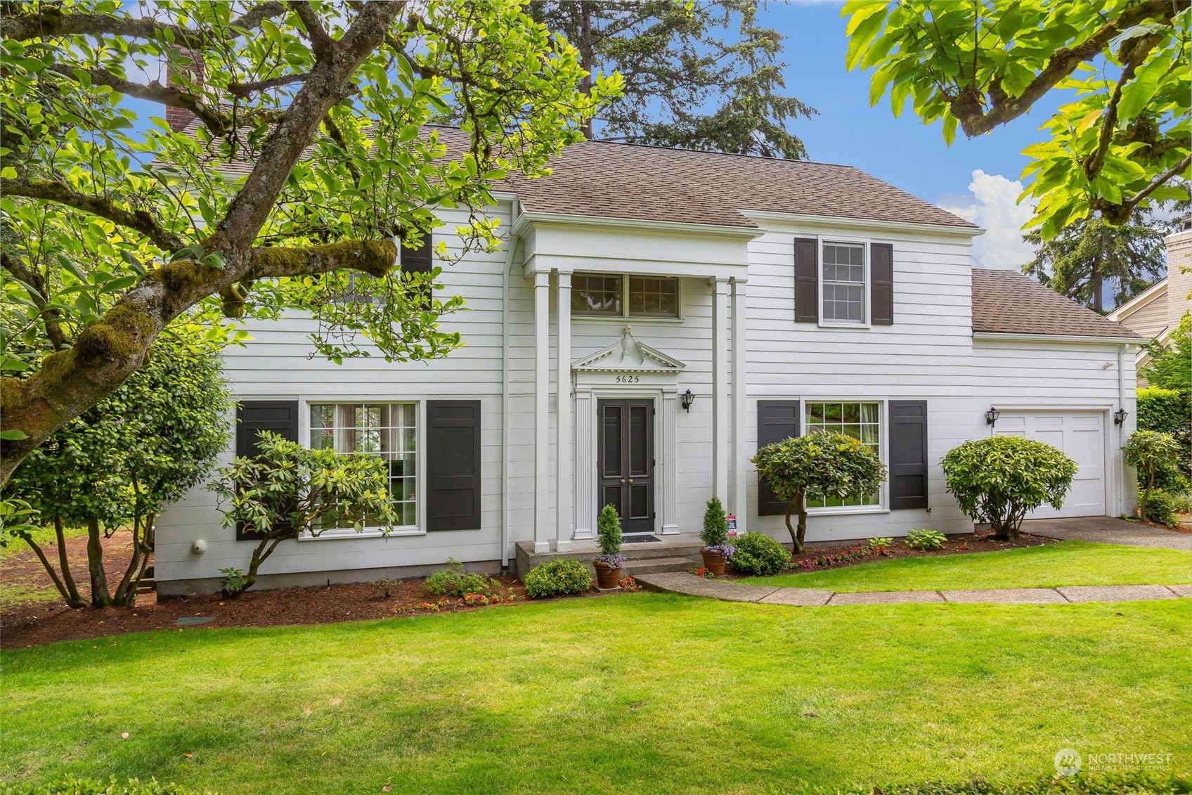 5625 Northeast Windermere Road Seattle, WA 98105 - Photo 1 of 40 a front view of a house with a yard