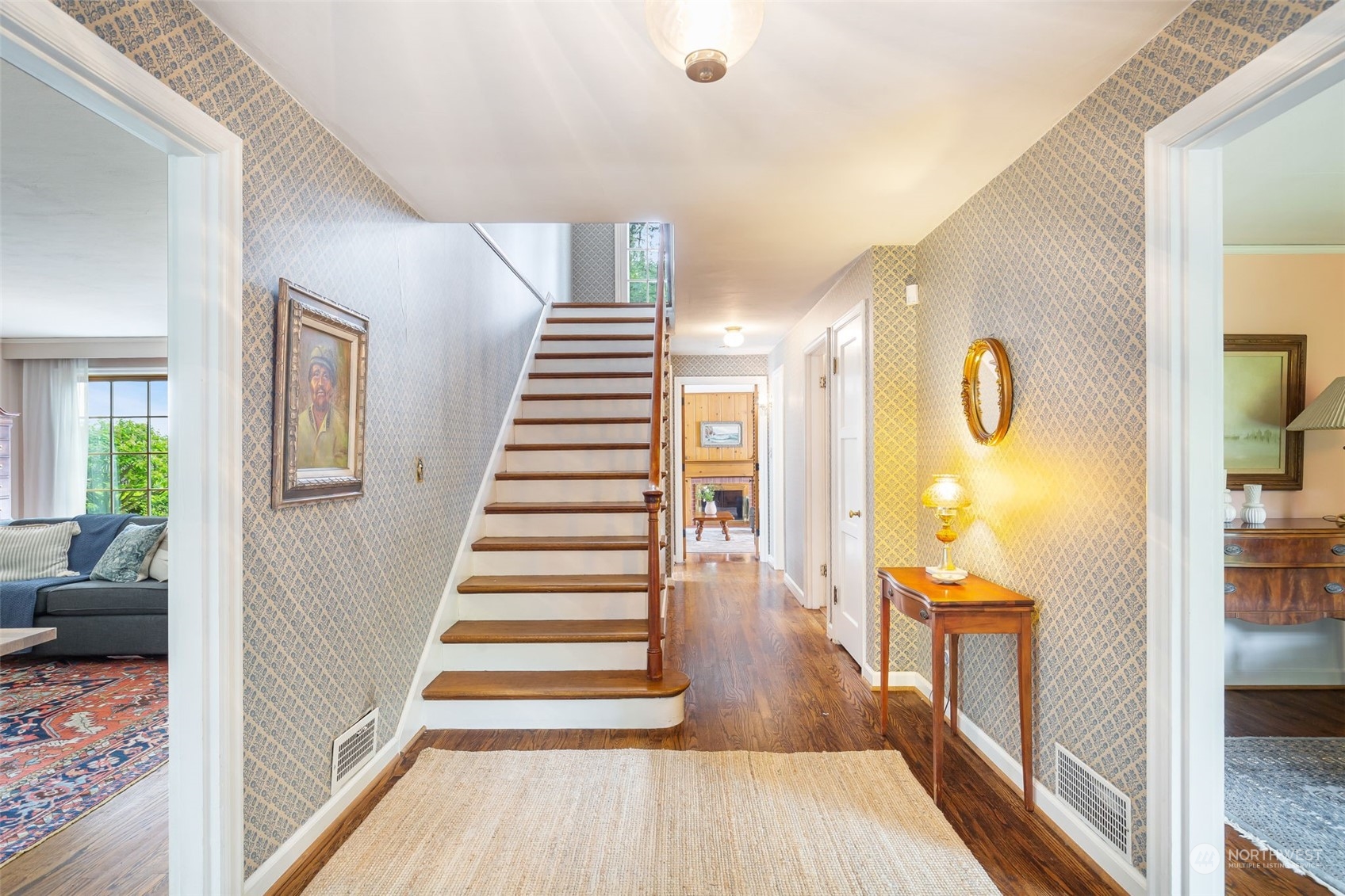 5625 Northeast Windermere Road Seattle, WA 98105 - Photo 5 of 40 a view of a hallway view with wooden floor and staircase