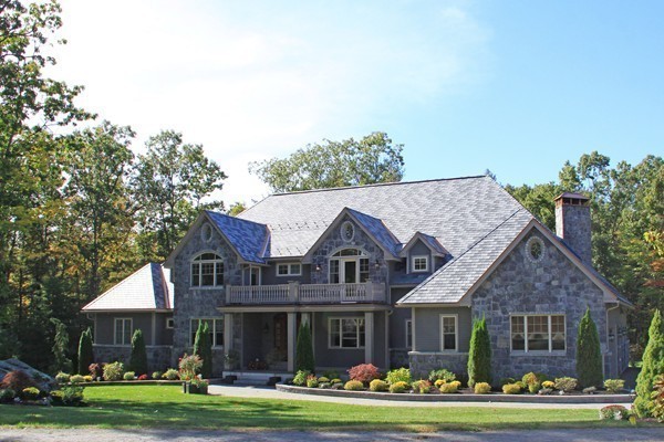54 Monarch Path Groton, MA 01450 - Photo 2 of 29 a front view of a house with a garden and plants