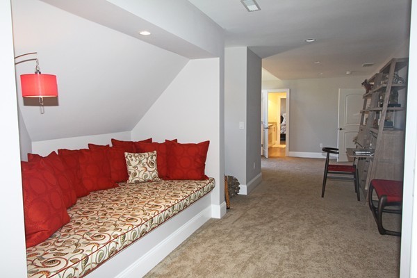 54 Monarch Path Groton, MA 01450 - Photo 22 of 29 a living room with a couch and a dresser