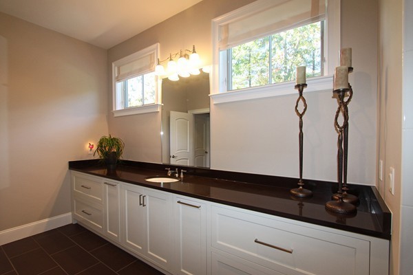 54 Monarch Path Groton, MA 01450 - Photo 26 of 29 a bathroom with a granite countertop sink and a mirror