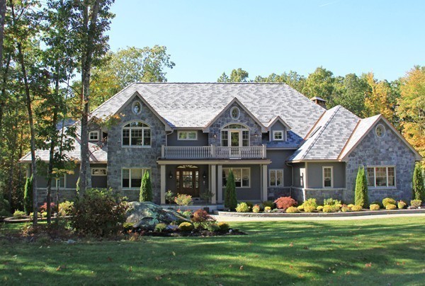 54 Monarch Path Groton, MA 01450 - Photo 28 of 29 a front view of a house with a garden and porch