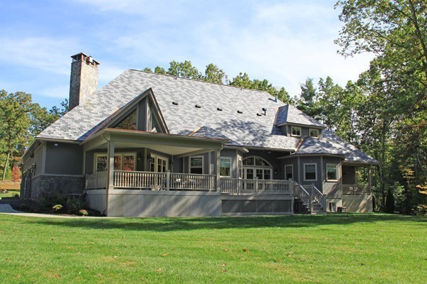54 Monarch Path Groton, MA 01450 - Photo 4 of 29 a front view of a house with a garden
