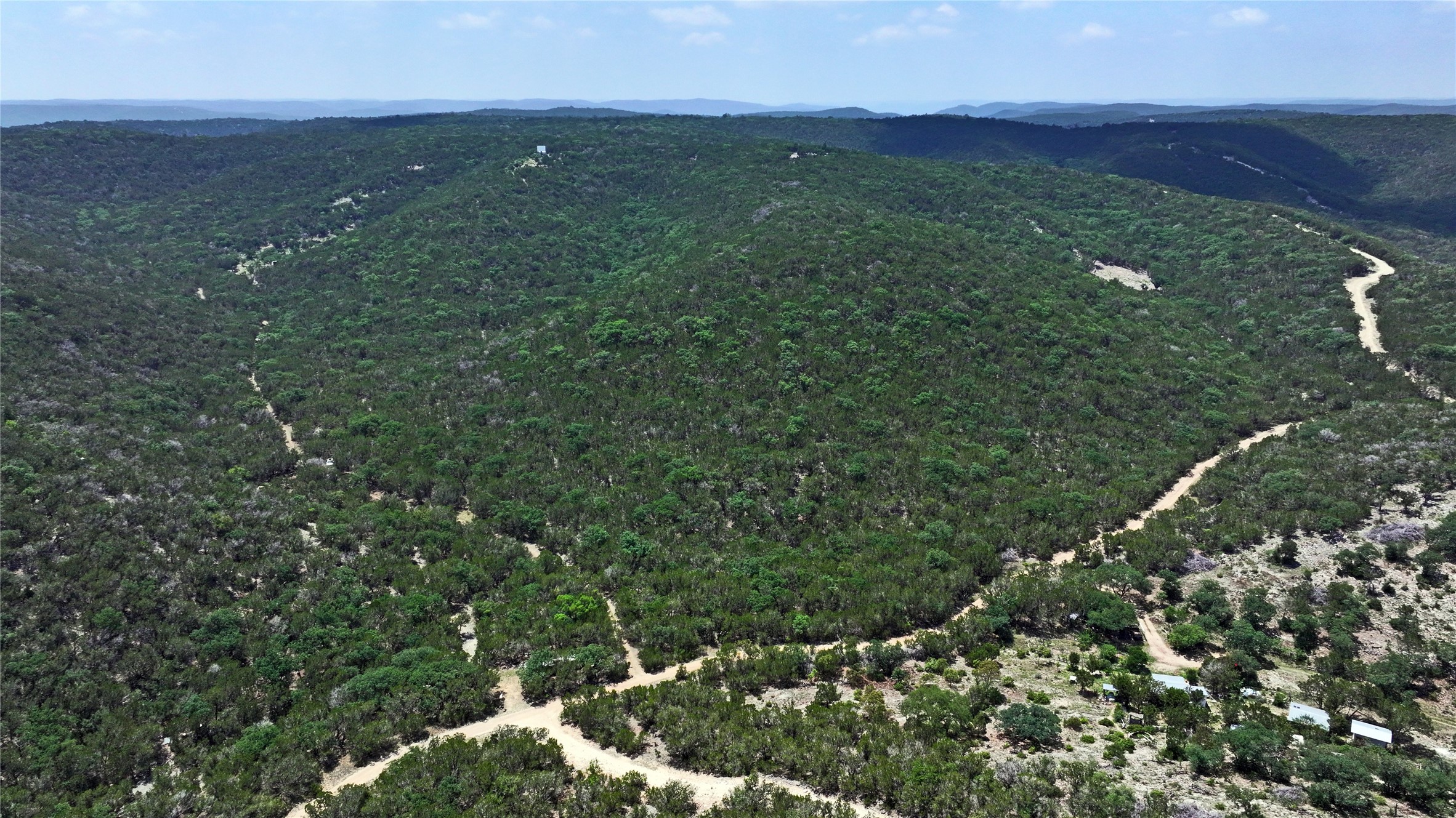Lot 129 Spring Country Ranch Road Leakey, TX 78873 - Photo 12 of 19 a view of a green field with lots of bushes